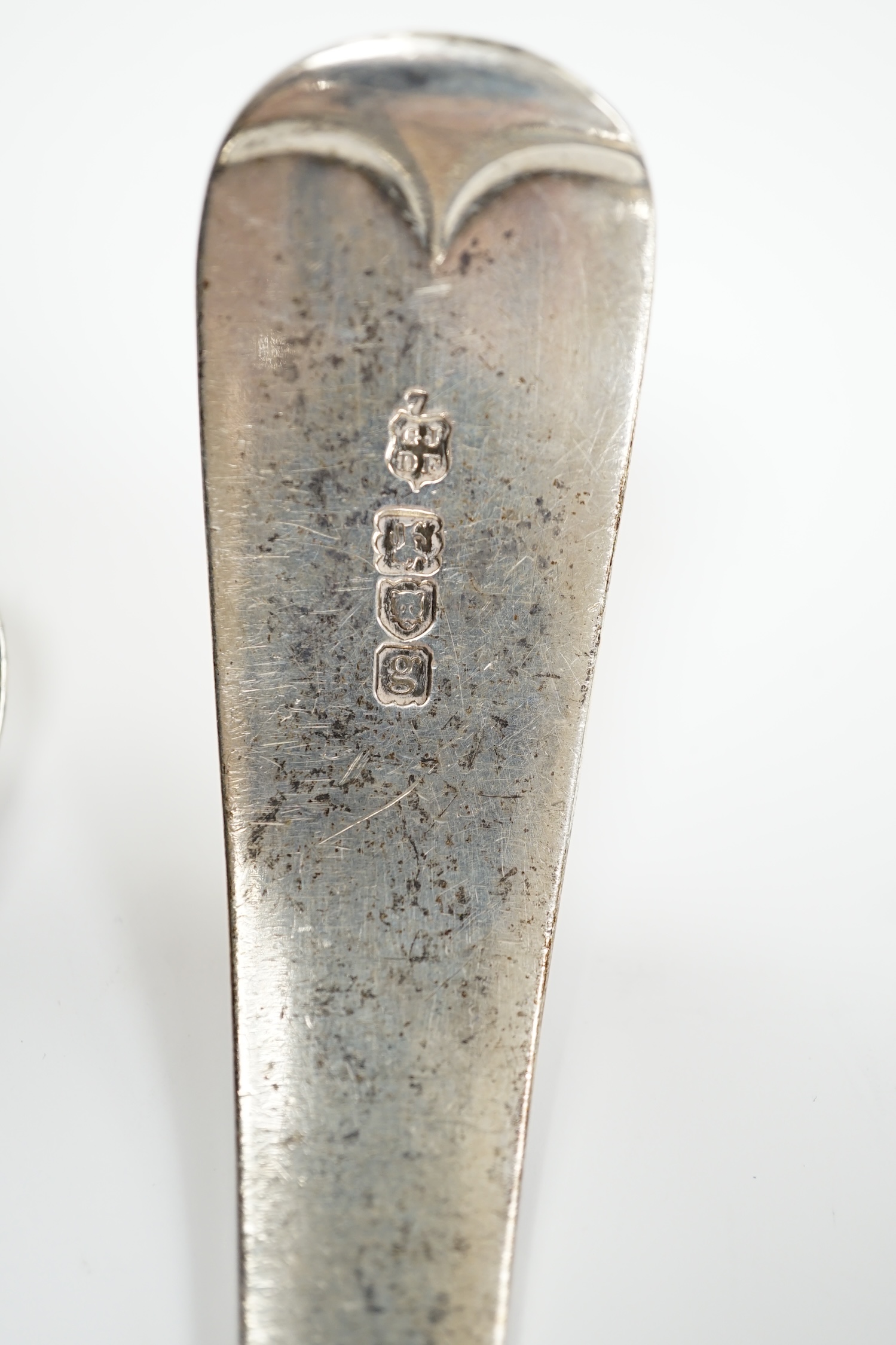 An Edwardian silver Old English pattern soup ladle, London, 1902 and a George III basting spoon, London, 1808, 12.8oz.